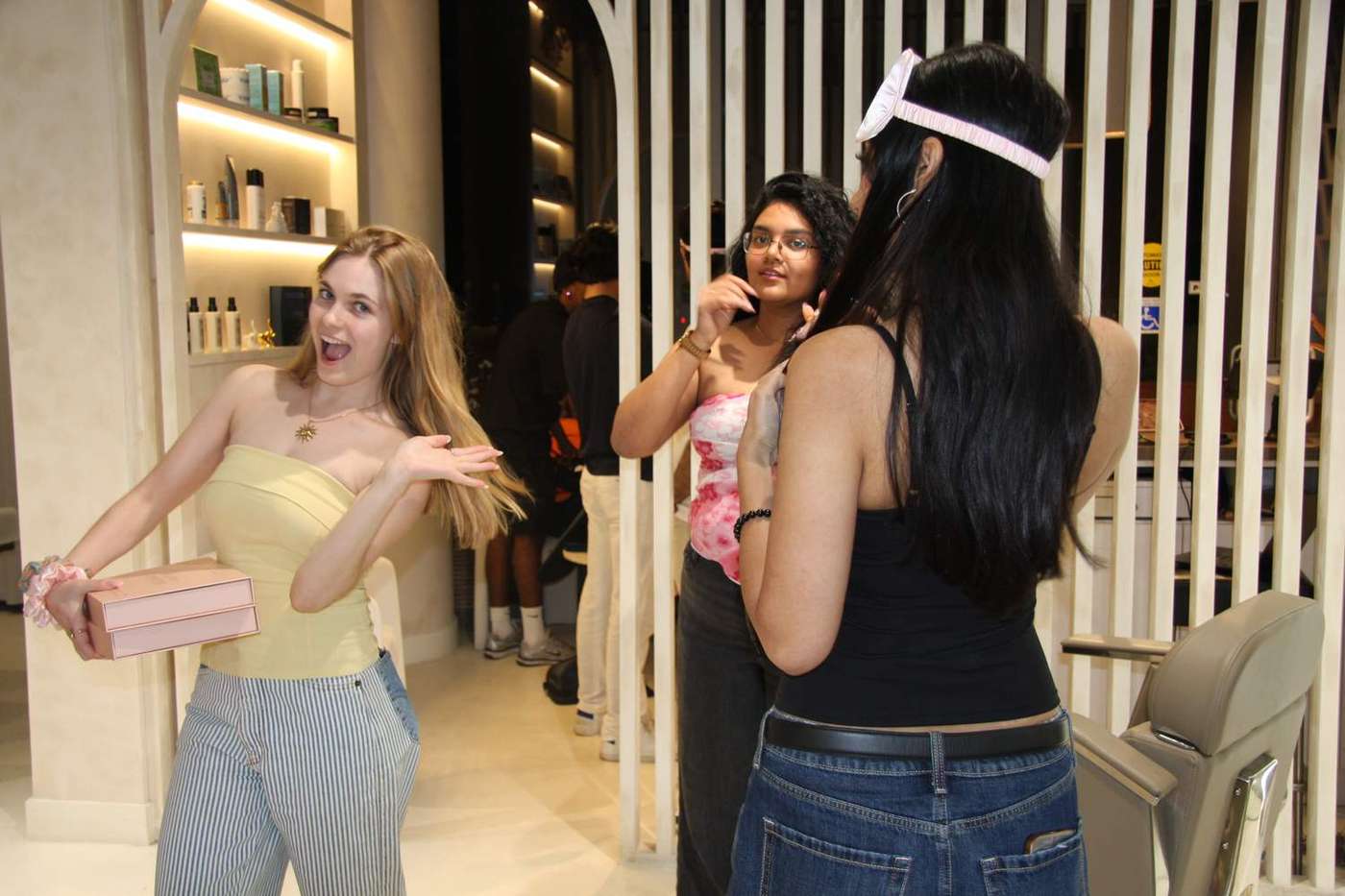 Customers and staff inside a Toronto salon during business hours